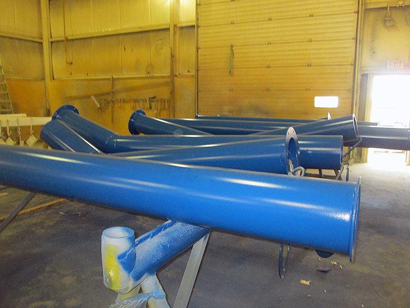 blue color finish painted pipe spools workshop