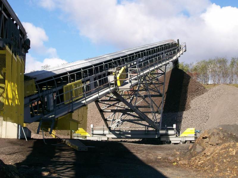 Screen Station Buildings and Screen Feed&Discharge Conveyors Steel Structures: 48” X 100’ Radial Stacker; wrap drive with lever-arm gravity take-up 