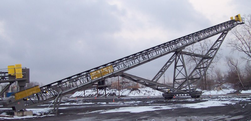 Screen Station Buildings and Screen Feed&Discharge Conveyors Steel Structures: 36” x 150’ Radial Stacker; wrap drive with lever-arm gravity take-up “roll-away” oversize chute 